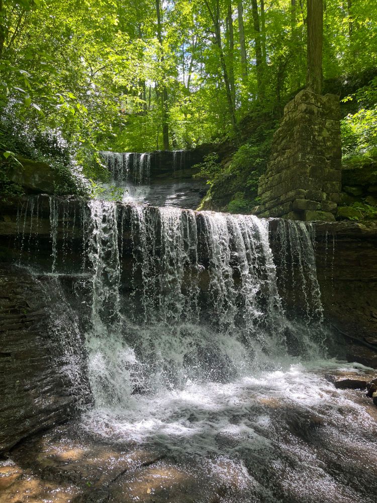 A beautiful double-decker waterfall in the woods