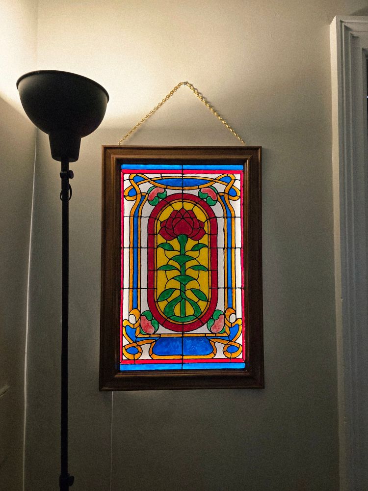 Stained glass panel depicting a rose