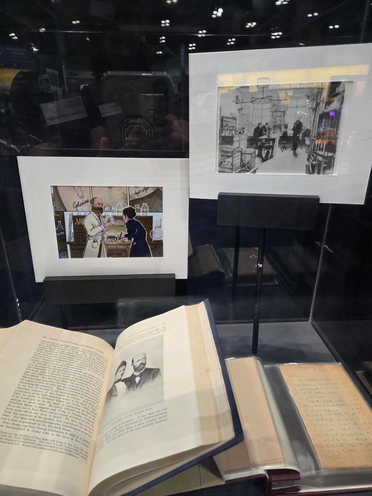 An open book in a glass case 