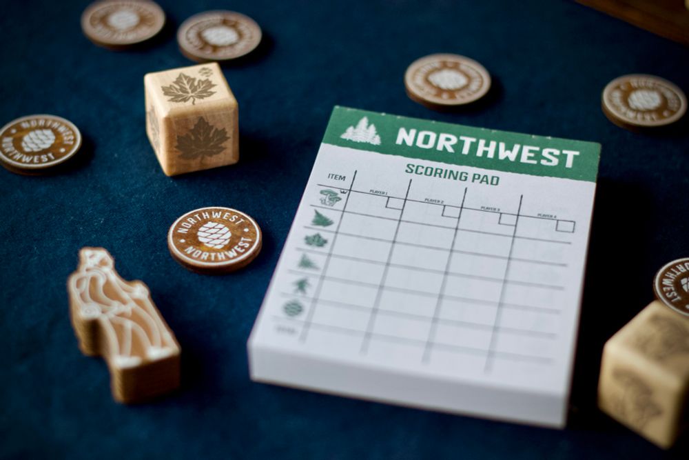 The scoresheet pad with game pieces scattered around it. 