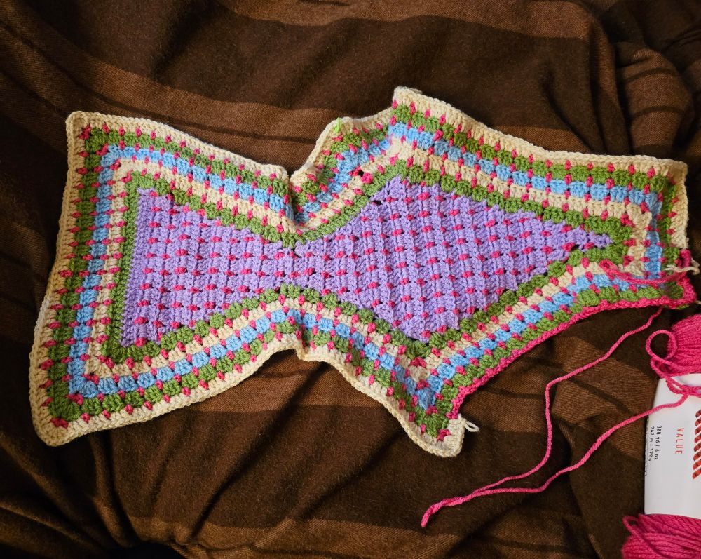 The armpit of a tailored hexagon cardigan 