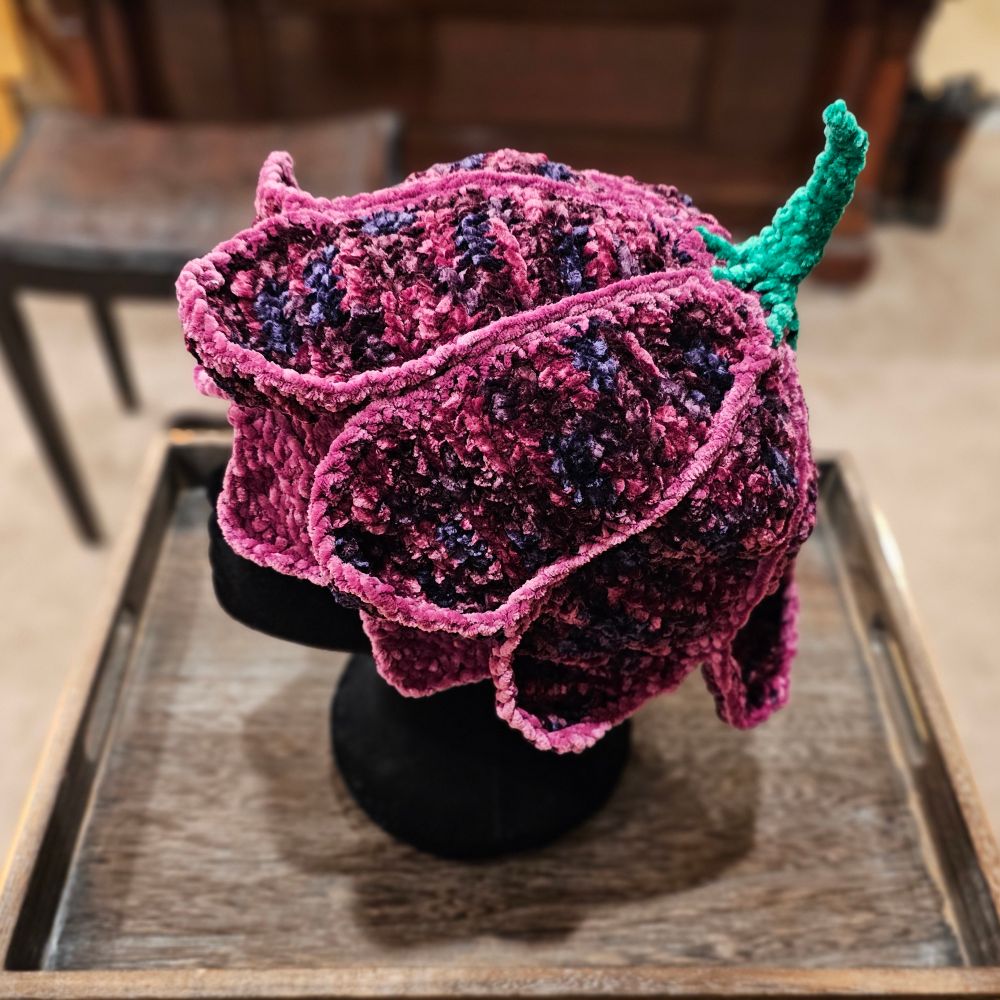 Flower hat reminiscent of the Preserver caps in ElfQuest 