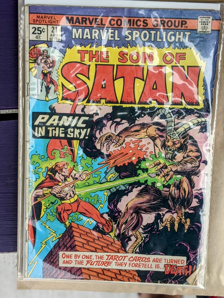 Daimon Hellstrom getting blasted by a demon with chicken feet atop a roof.