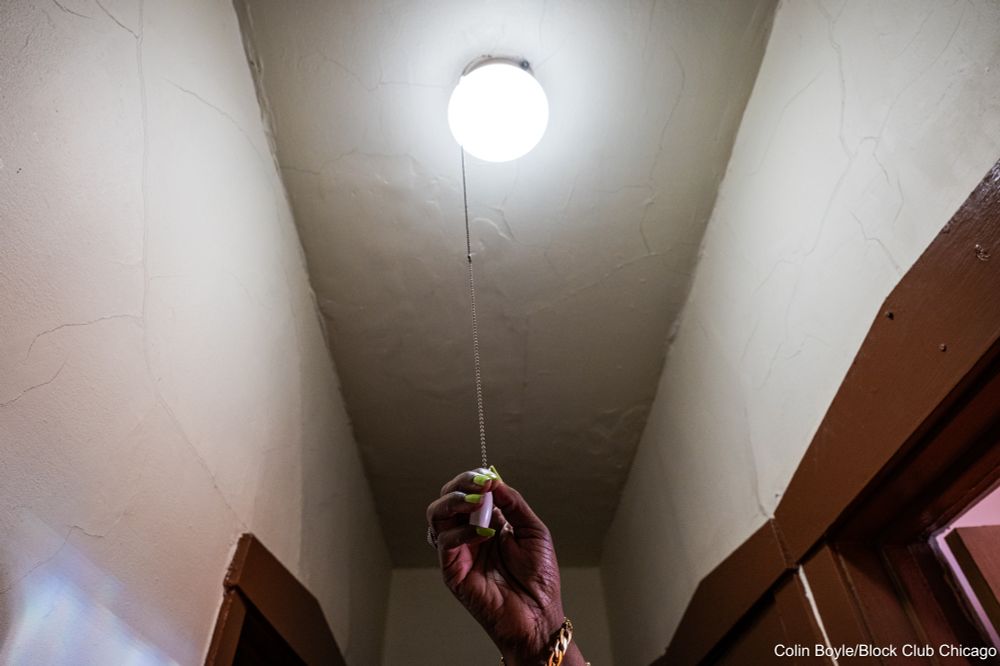 Delores Campbell pulls the light switch in her home in the Austin neighborhood on June 23, 2025. Credit: Colin Boyle/Block Club Chicago
