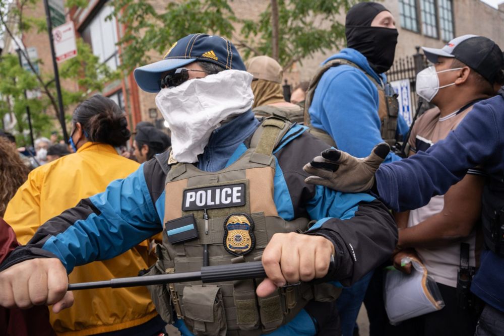 Federal agents force people back as they detain several people at the Intensive Supervision Appearance Program office, 2245 S. Michigan Ave., in South Loop on June 4, 2025. Credit: Sebastián Hidalgo for Block Club Chicago
