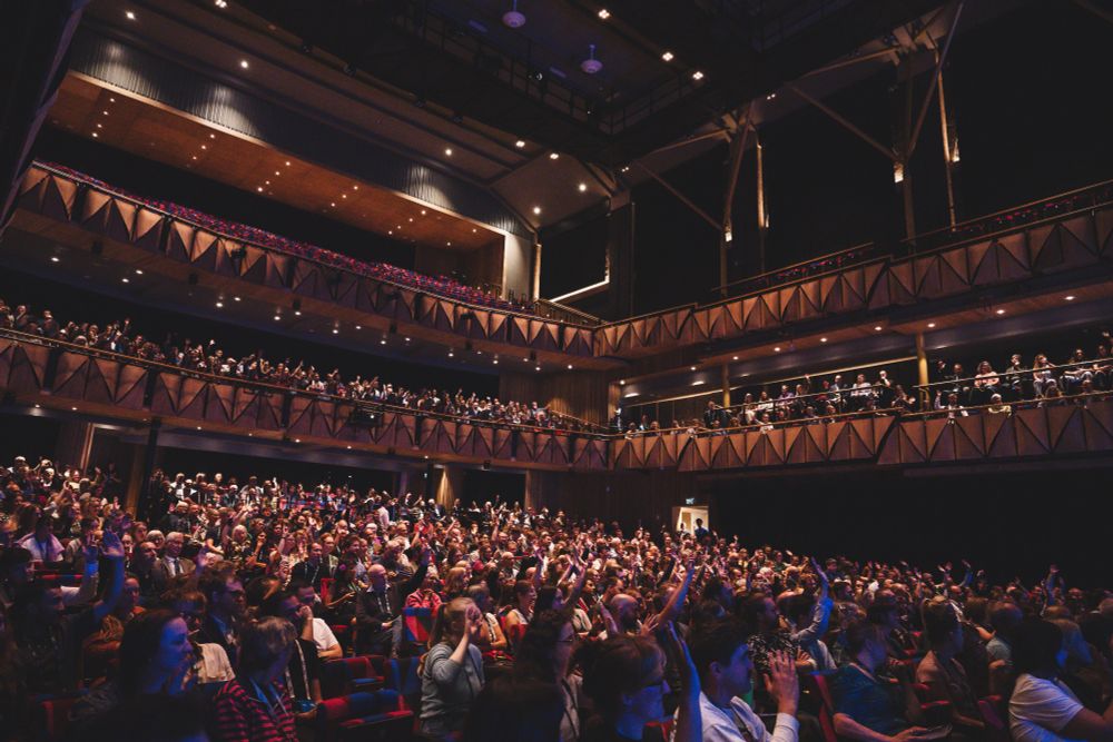 A packed crowd of people in the Bristol Beacon