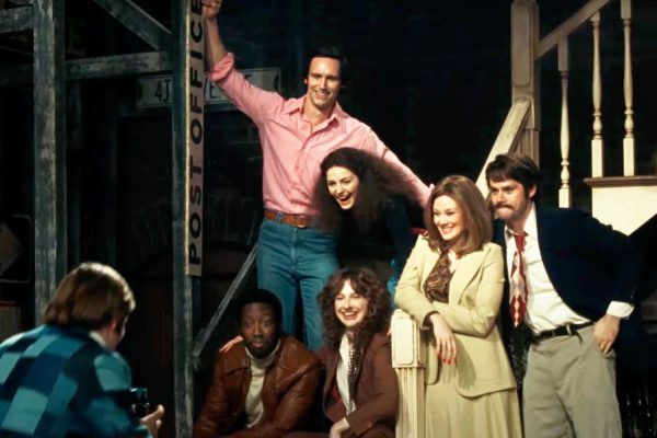 A still of the actors playing the case members from the first episode of Saturday Night Live in 1975 from Saturday Night (2024).