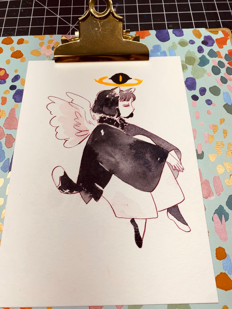 A small tuxedo spirit. Its nine lives spent protecting others, now it sits and rests. 