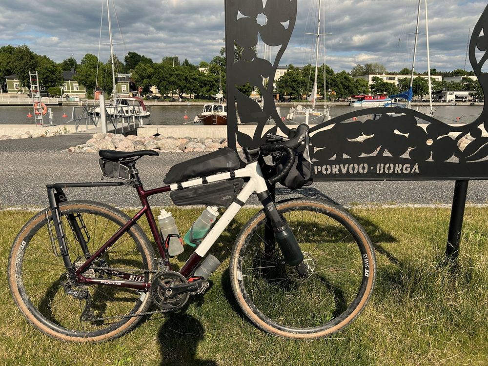 Bike next to metal art work that says Porvoo - Borga