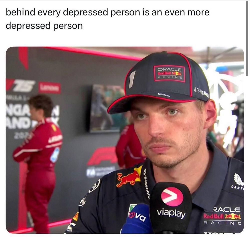 a meme with text: behind every depressed person is an even more depressed person

and the photo is charles Leclerc standing in the background on Max Verstappen’s media pen interview 