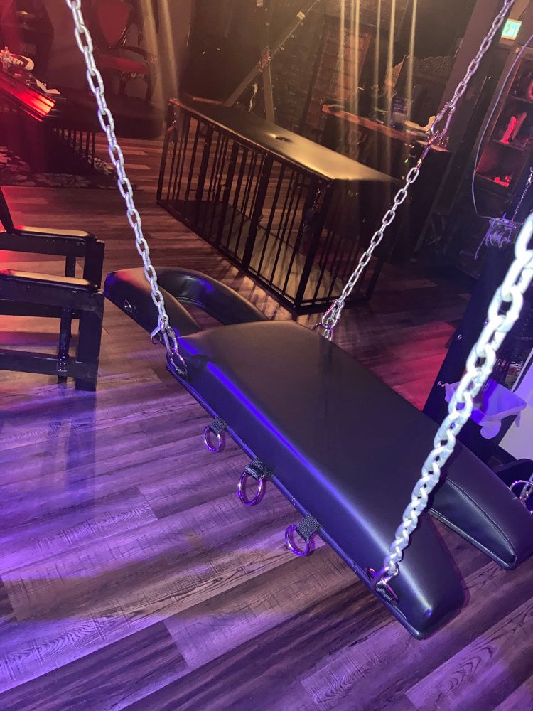 Custom sex sling in black leather.