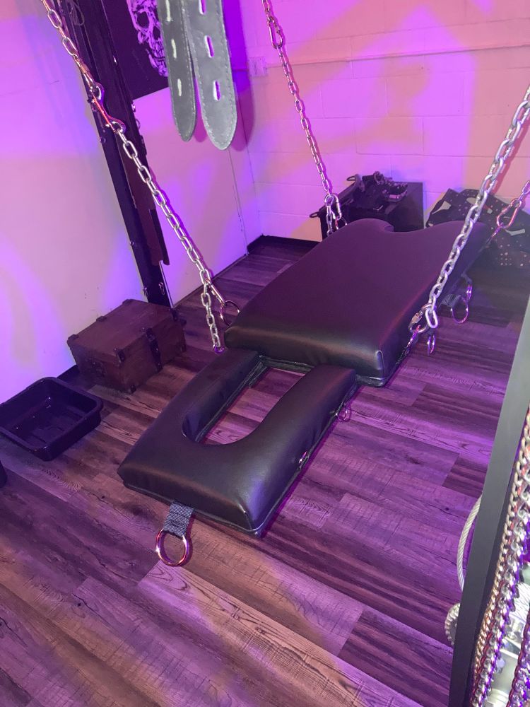 Custom sex sling in black leather.