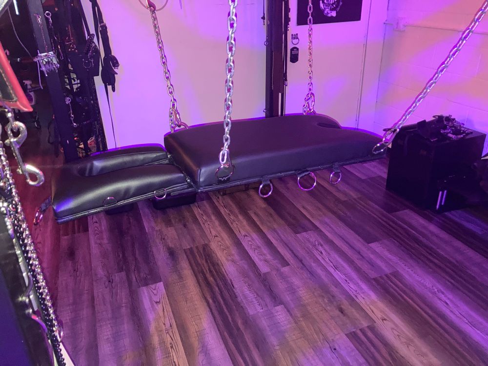 Custom sex sling in black leather.