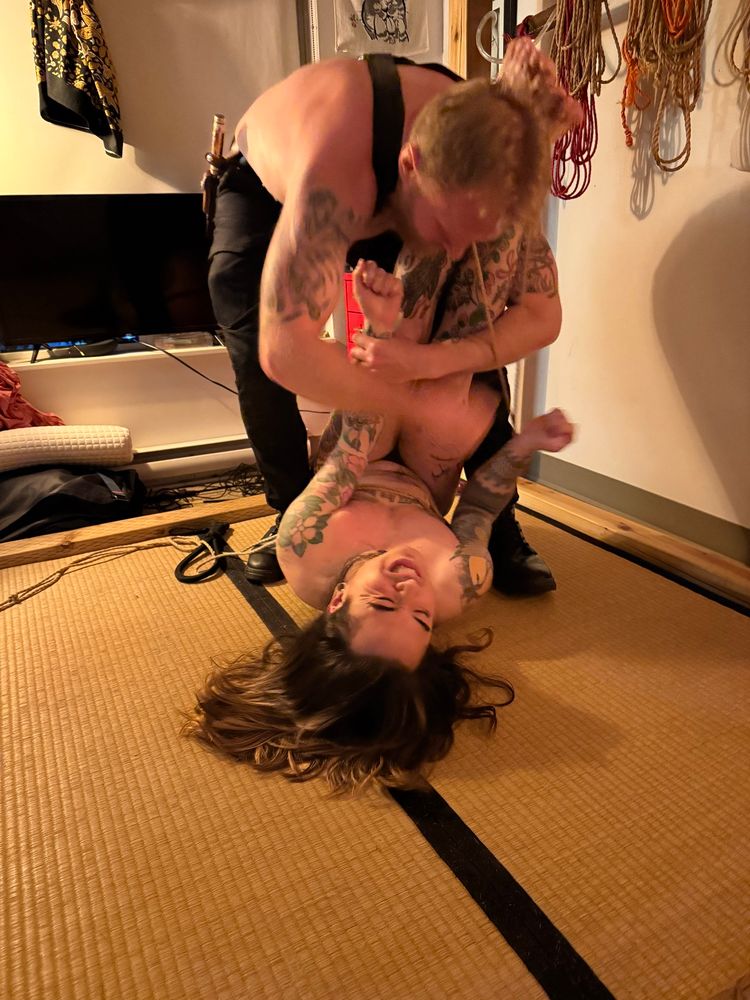A good boy squirms on the ground while being punched and grappled by Master Wolfe.