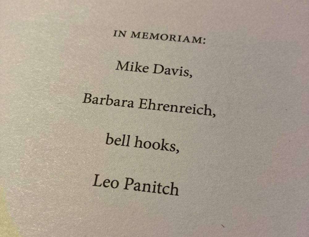 A page in a book reads: IN MEMORIAM: Mike Davis, Barbara Ehrenreich, bell hooks, Leo Panitch
