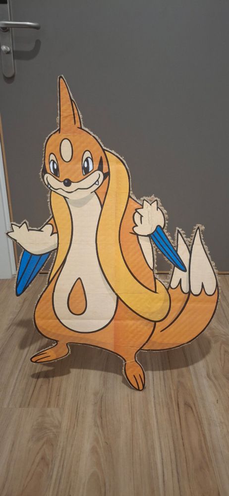 A cardboard cutout of the Pokémon Floatzel as seen from the front.