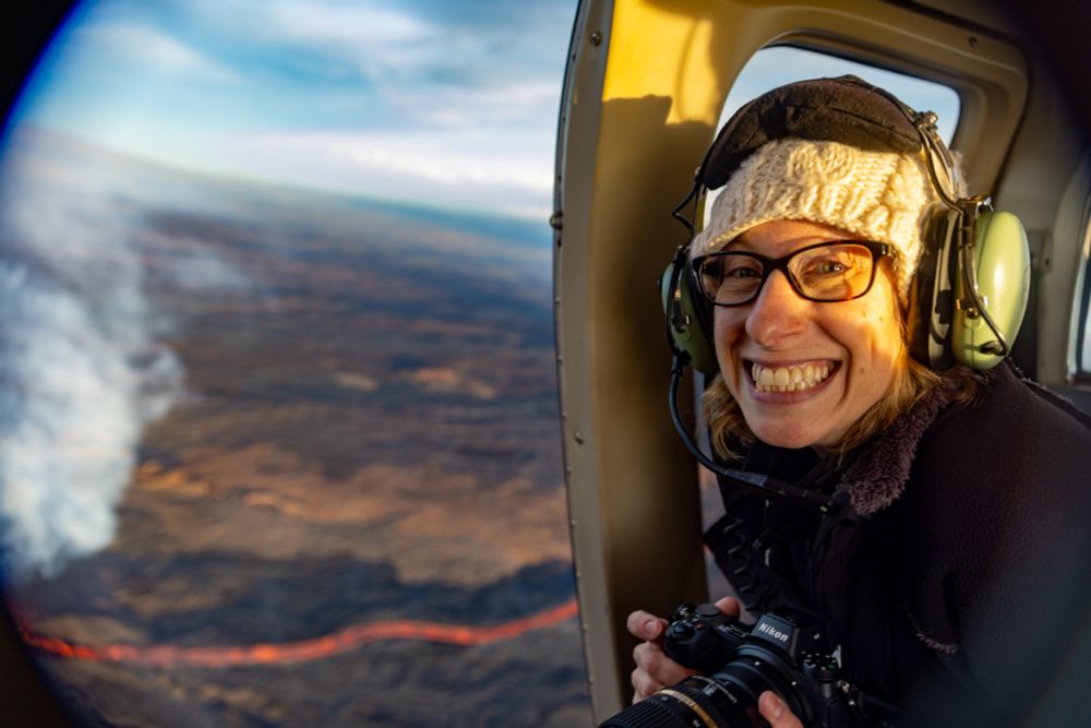Jen grinning in the helicopter