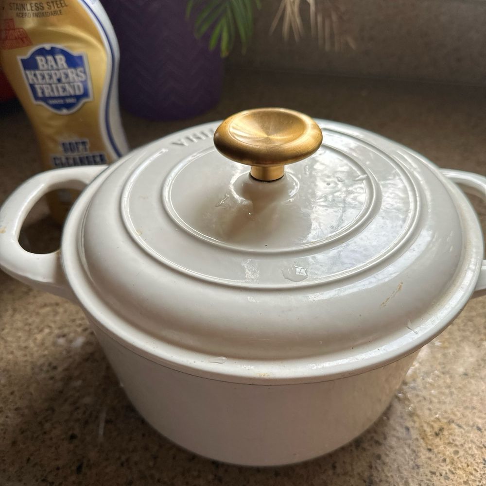 white dutch oven on a kitchen counter 