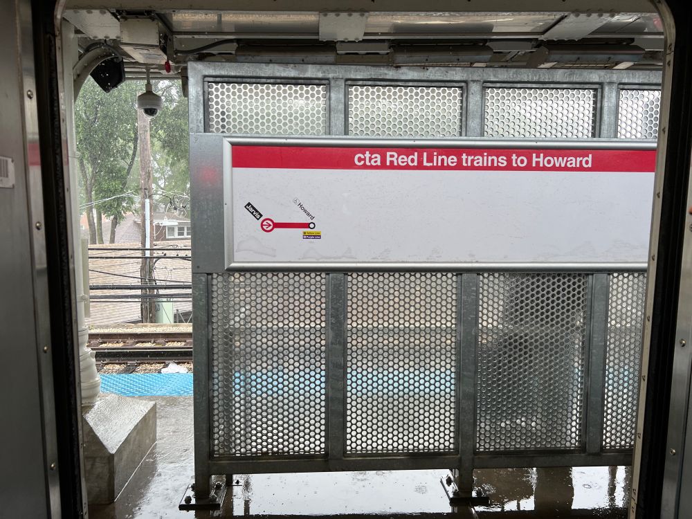 A sign with “cta Red Line trains to Howard” on it depicting the current station and Howard station only, very short and not helpful