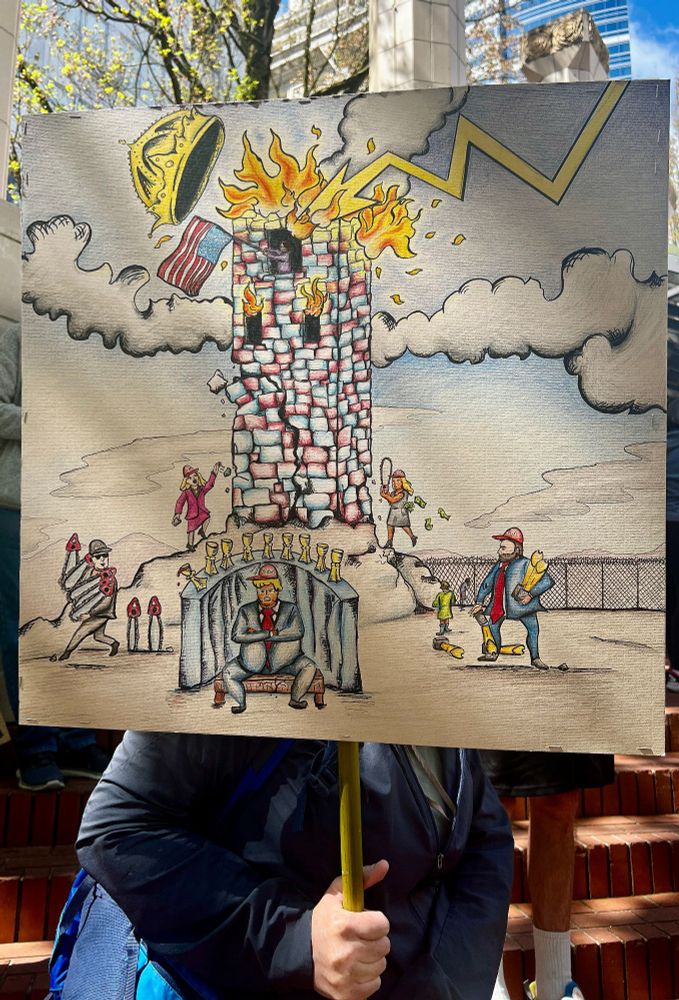 Protest sign showing the Tarot of Trump.
Nine of Cups & Seven of Swords