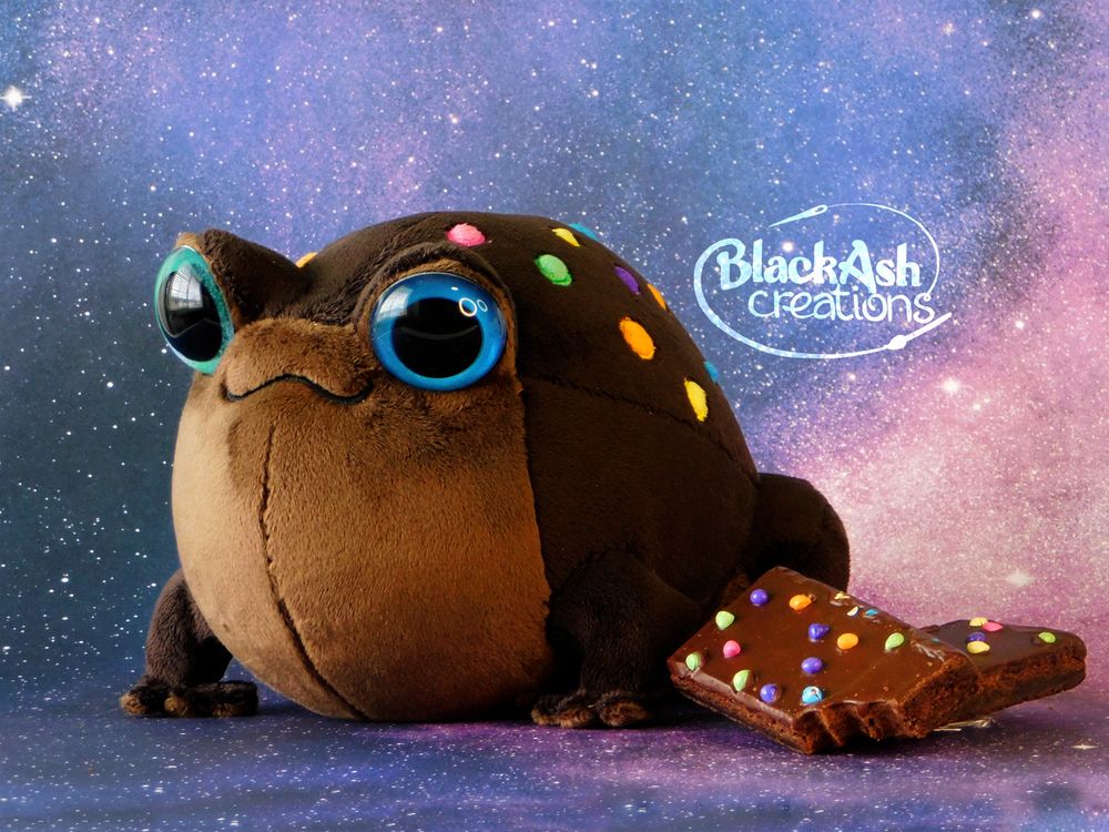 a frog plush made to look like a cosmic brownie