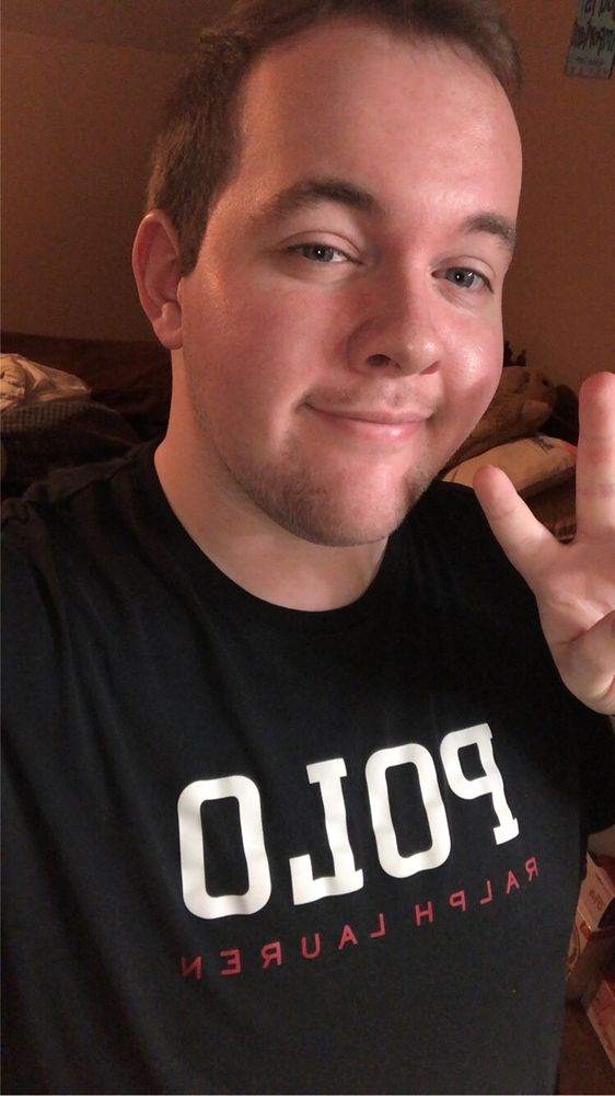 Will is giving a peace sign and showing off their new short haircut.