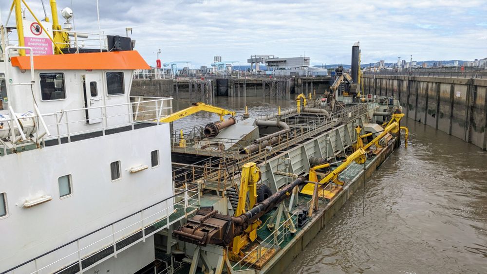 A great big dredger ship thing is seemingly heading straight for a harbour wall. You can just about see some of the dredging activity in the centre of the ship... it was both smelly and noisy.