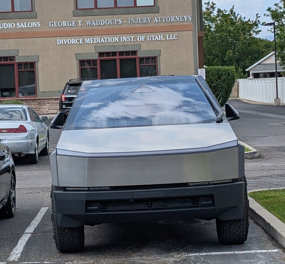 cybertruck in front of divorce mediation office