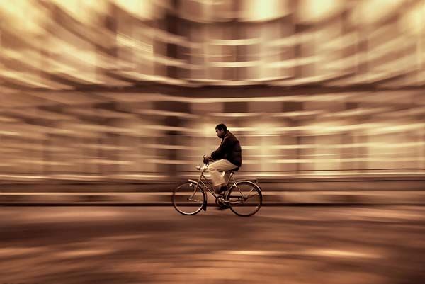 Background motion blur caused by tracking the motion of a moving bicycle.