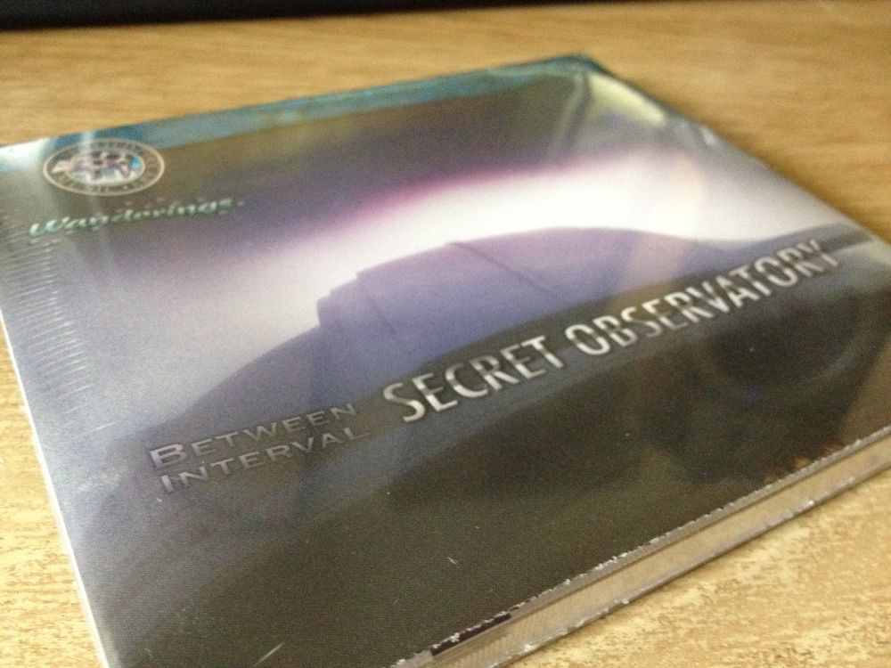 Photo of the CD version of Between Interval - Secret Observatory, still wrapped in plastic.