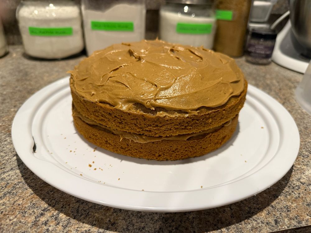 Two layer brown cake with brown icing. Coffee flavored cake and icing. 