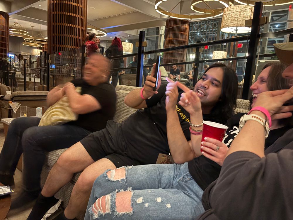 Innkeeper laughing. Anas is showing Bain & Chiad and Brian something on his phone. I’m capturing the craziness 