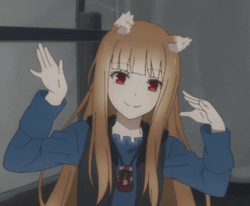 a girl with a cat ear on her head is waving