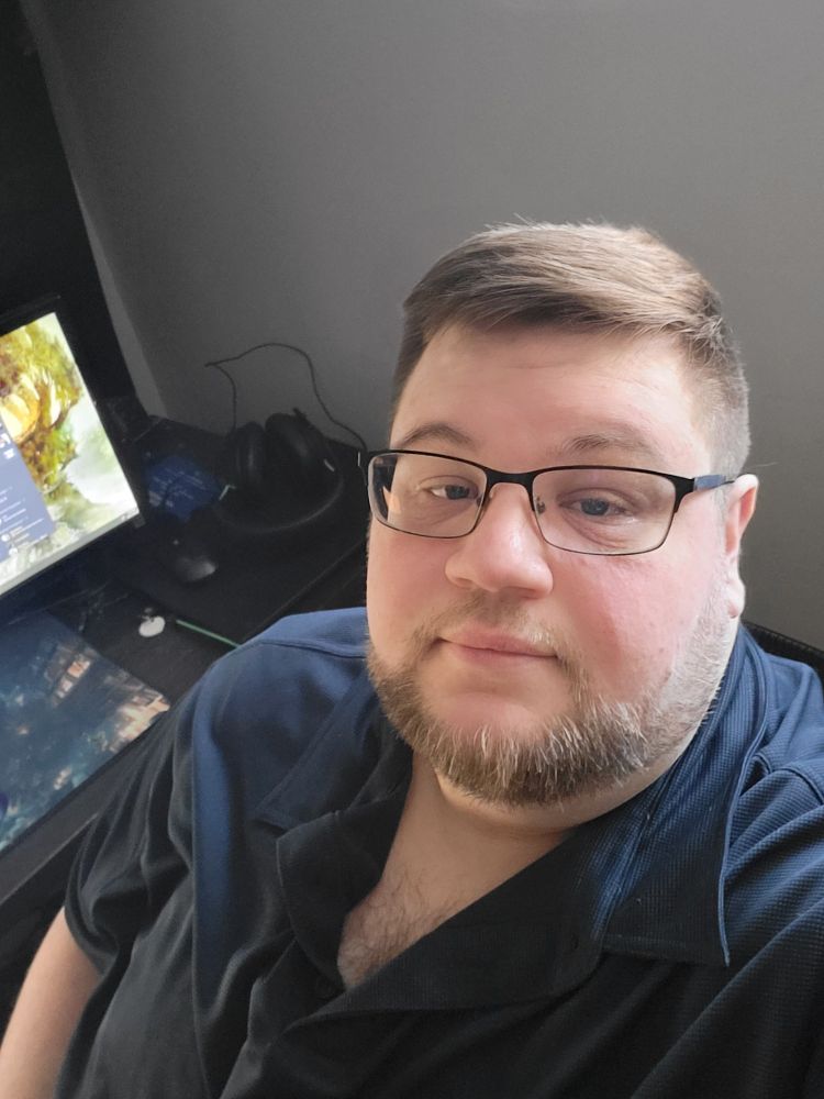 A picture of me, a man with glasses and a beard
