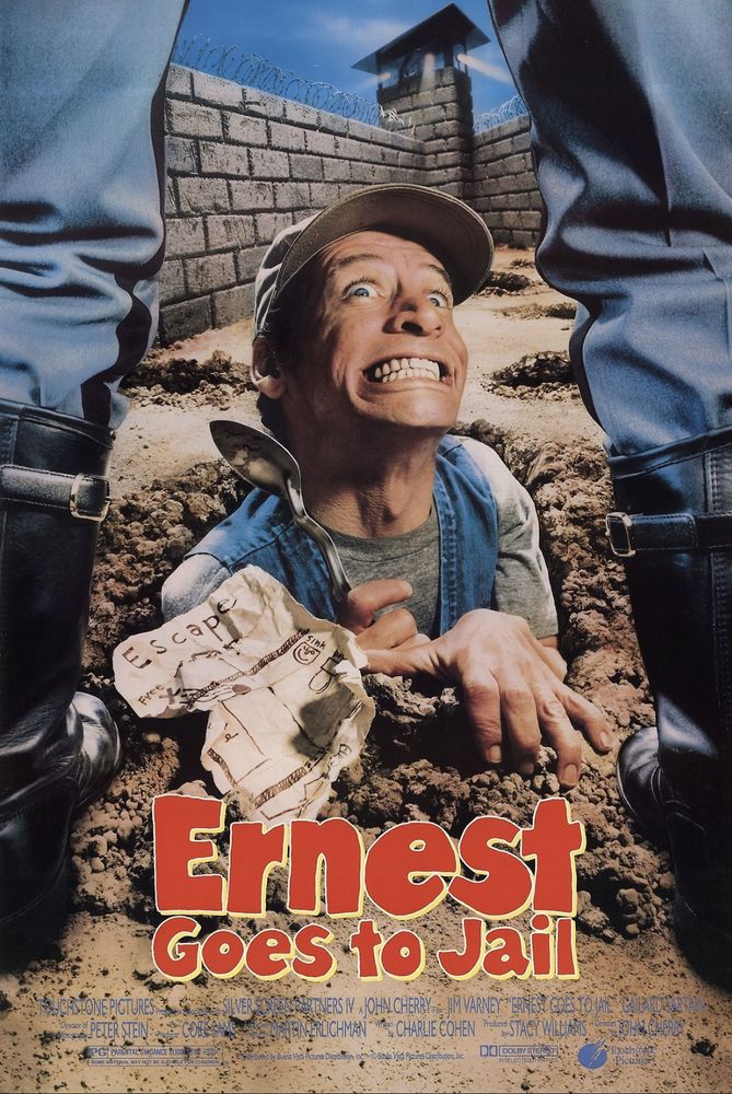 The poster for Ernest Goes to Jail (1990, John Cherry)
I'm at a loss to describe the facial expression he's making. Technically it's a smile but that word carries with it an expectation of warmth that is nowhere to be found in this image. Every tooth in Jim Varney's head is on full display. I don't think I've ever seen a face this tense, even a corpse in rigor mortis is more relaxed than this. And yet his eyes are a million miles away. It's like he's being electrocuted but doesn't care.