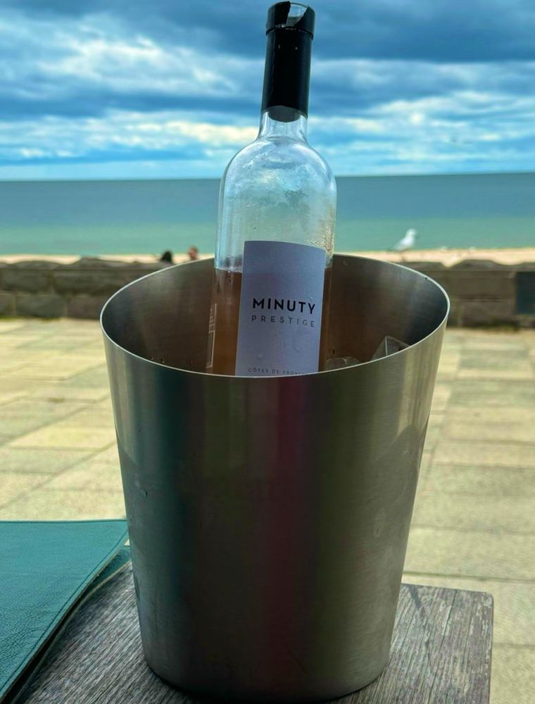 Wine in wine bucket by the beach 