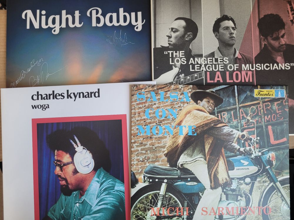 Picture of 4 different LPs; clockwise from top left:"You'll Never Work in This Town Again" by Night Baby, "The Los Angeles League of Musicians" by LA LOM, "Salsa con Monte" by Michi Sarmiento y su Combo Bravo, and "Woga" by Charles Kynard.