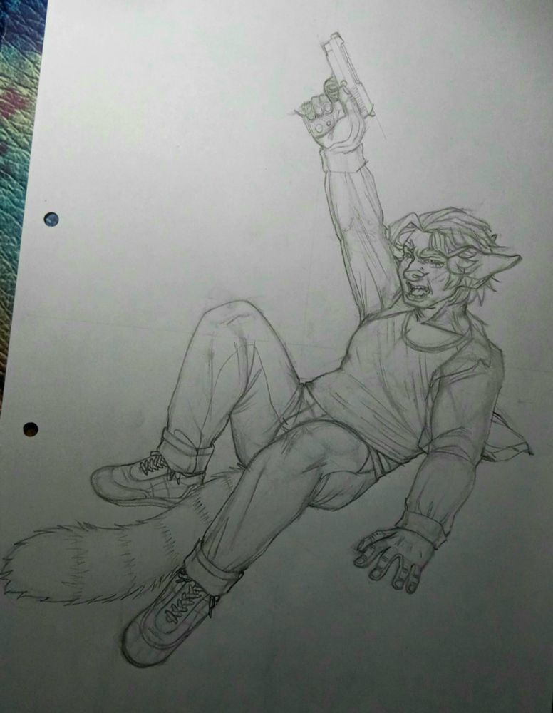 Forti laying on the floor holding a gun and rising it to the air. he's got a pretty angry facial expression