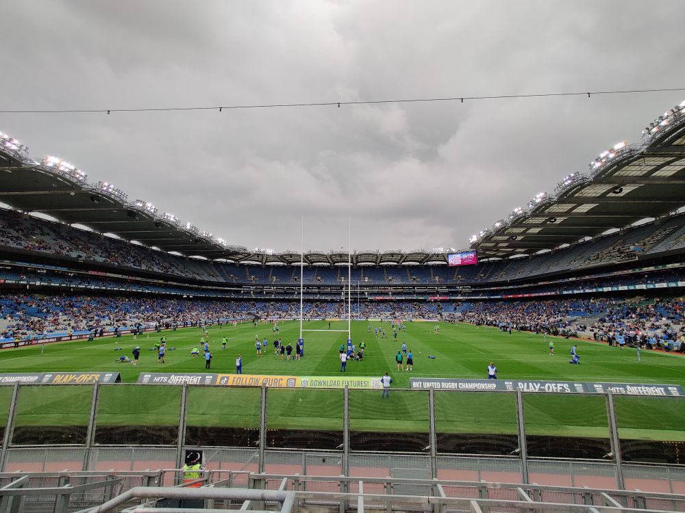 Croke Park as seen from Hill 16. Players are warming up on the pitch, the stadium is beginning to fill up, but mostly on the lower levels only 