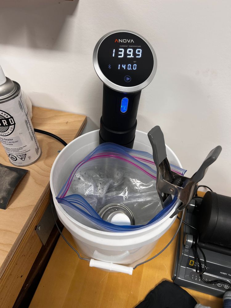 A can of aerosol paint in a sous vide bath. 
