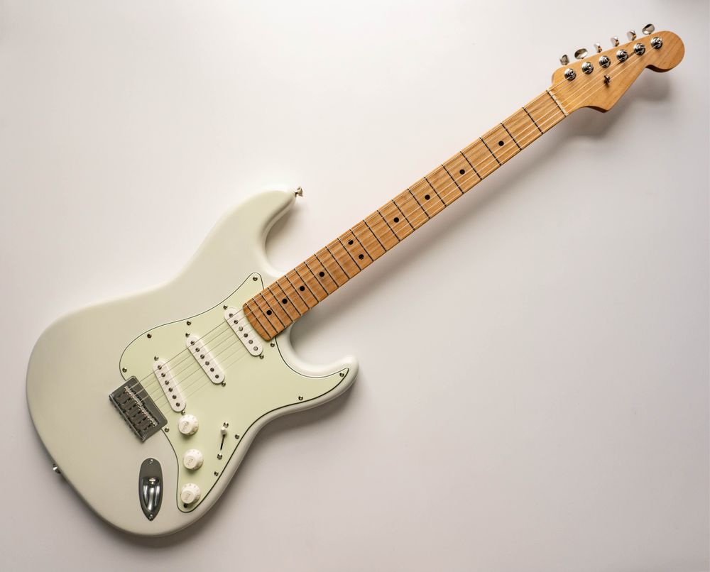 White Stratocaster with maple neck. 
