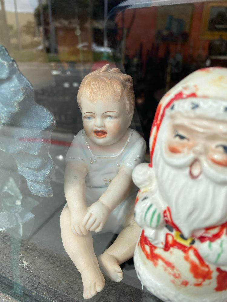 Crying child and Santa figurines