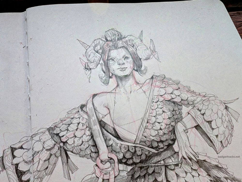 A close up of the same image with the sketchbook at a slight angle.