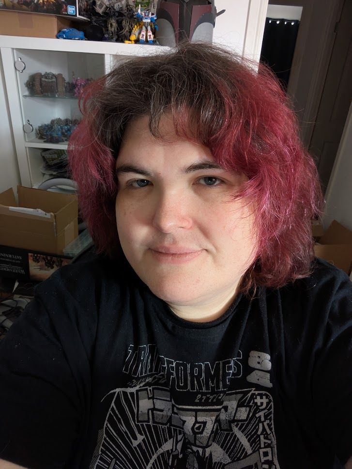 A photo of me (fat white trans woman) with fluffy hair.
