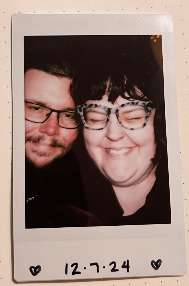 Polaroid of Kenzie and tyrsson with “12/7/24” 