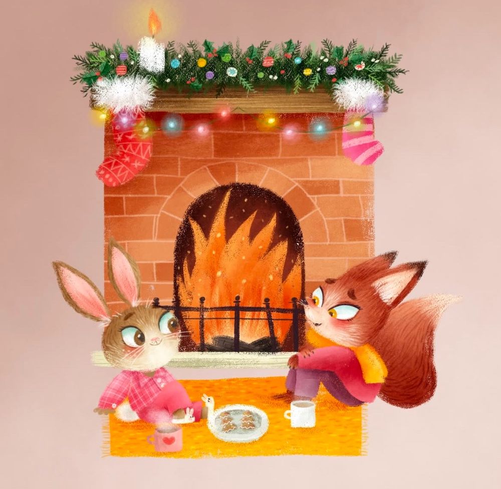 A fox and rabbit, dressed in pyjamas, sit in front of an open fire. They have hot chocolates and cookies. Stockings hang from the fireplace.