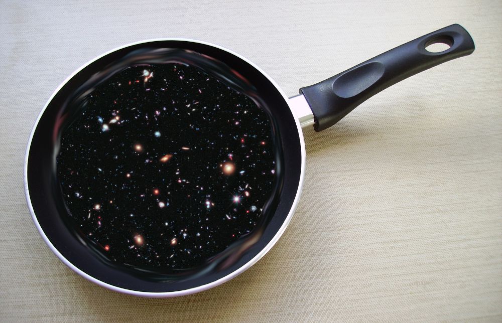 This is a frying pan containing a portoin of the Hubble Deep Field imagery as if it were a frittata.