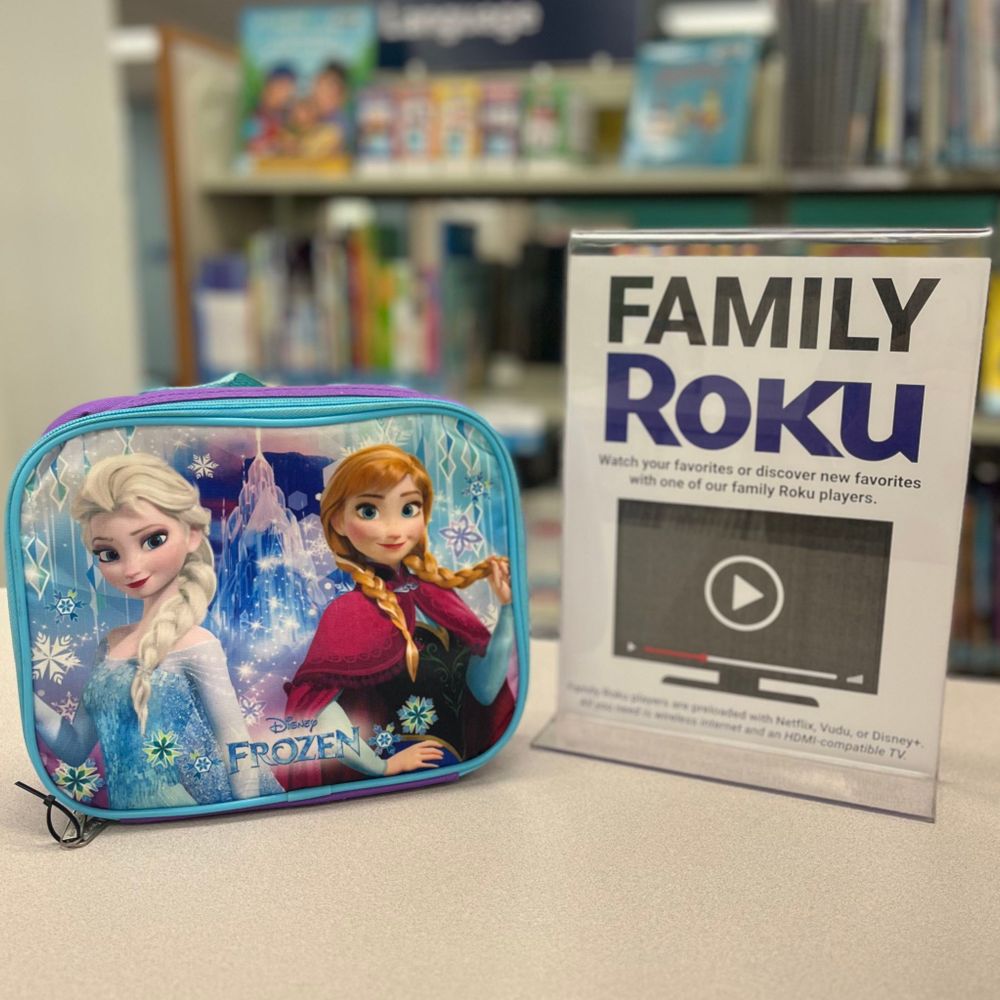 Frozen lunch box next to a sign that says, "Family Roku."