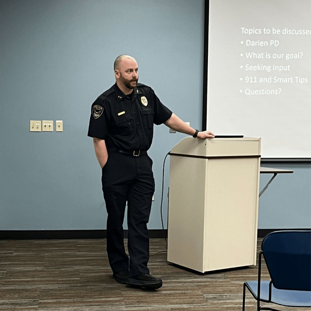 Deputy chief standing and talking.