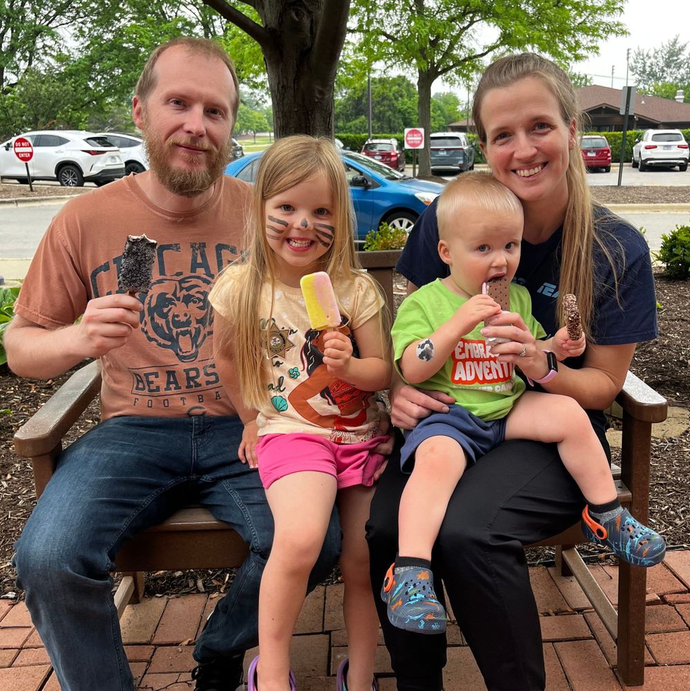 Family sitting and enjoying ice cream.